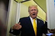 President Donald Trump speaks to reporters on Air Force One on his way to his Mar-a-Lago estate ...