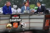 FILE - From left, Pat Mcafee, Nick Saban and Kirk Herbstreit talk on the set of ESPN College Ga ...