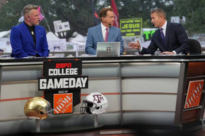 FILE - From left, Pat Mcafee, Nick Saban and Kirk Herbstreit talk on the set of ESPN College Ga ...