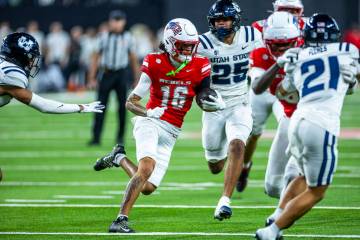 UNLV wide receiver Kayden McGee (16) cuts upfield on his way to scoring a touchdown for the win ...