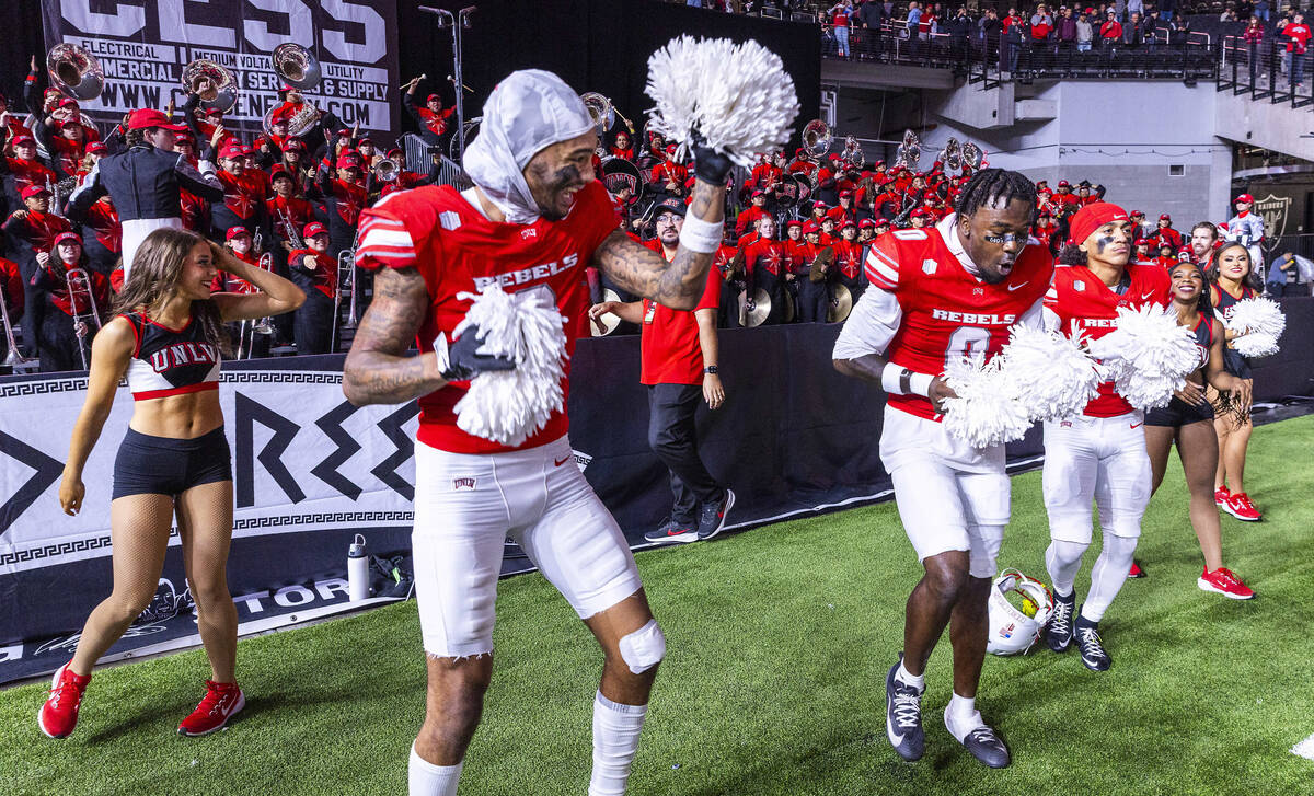 UNLV defensive back Mumu bin-Wahad (6), defensive back Laterrance Welch (0) and defensive back ...