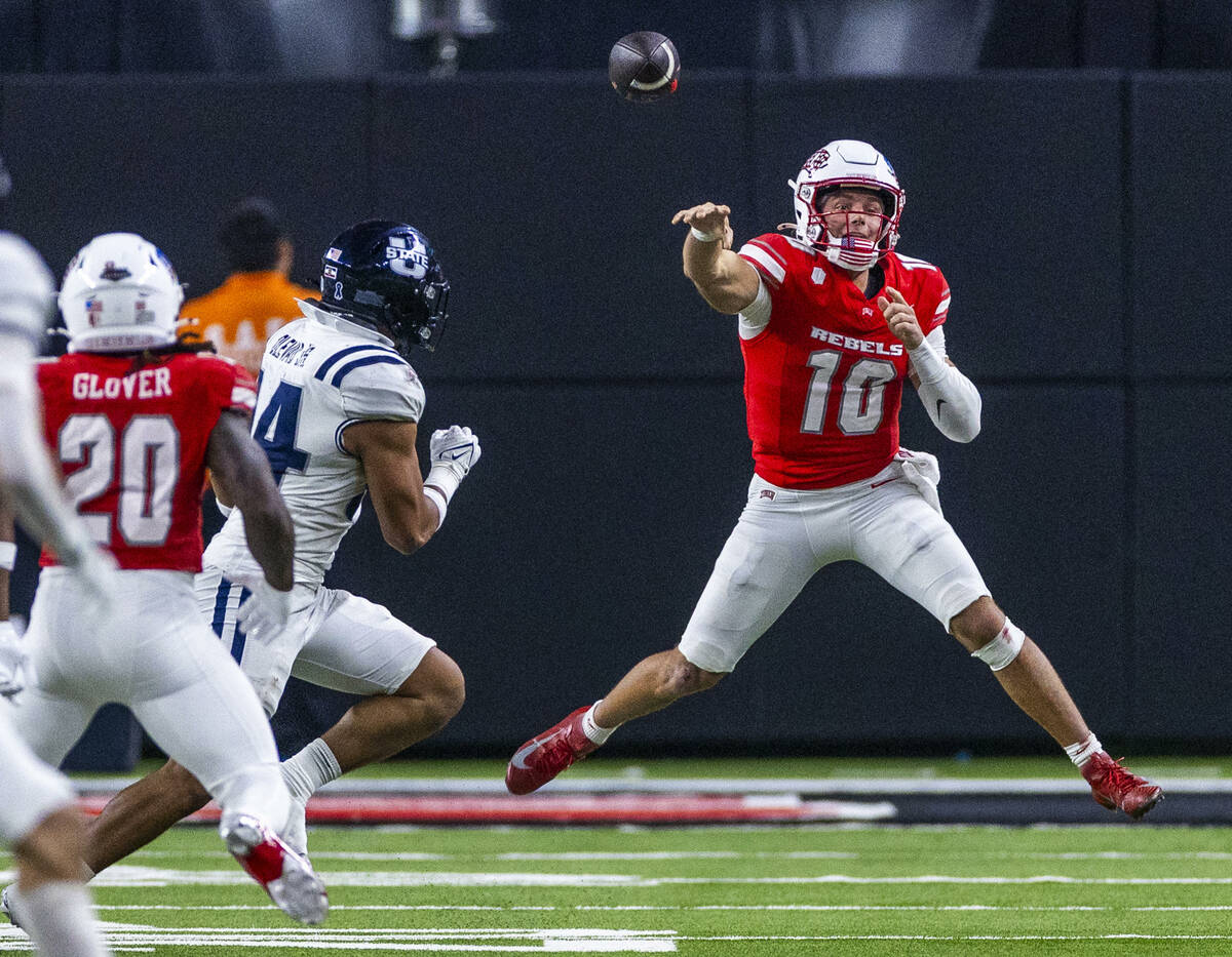 UNLV quarterback Anthony Colandrea (10) elevates while getting off a pass on the run as Utah St ...