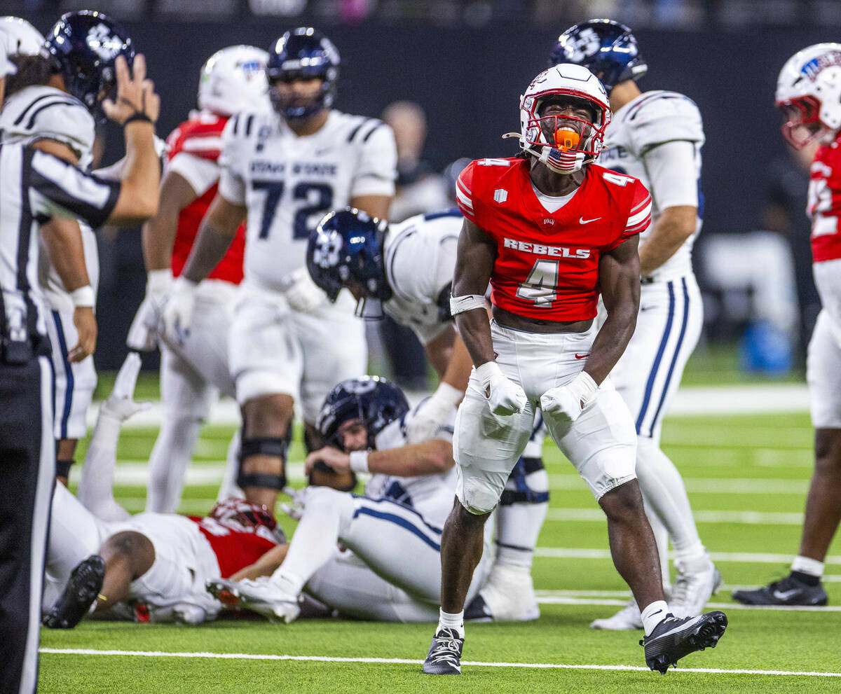 UNLV defensive back Andrew Powdrell (4) is pumped after a sack on Utah State Aggies quarterback ...
