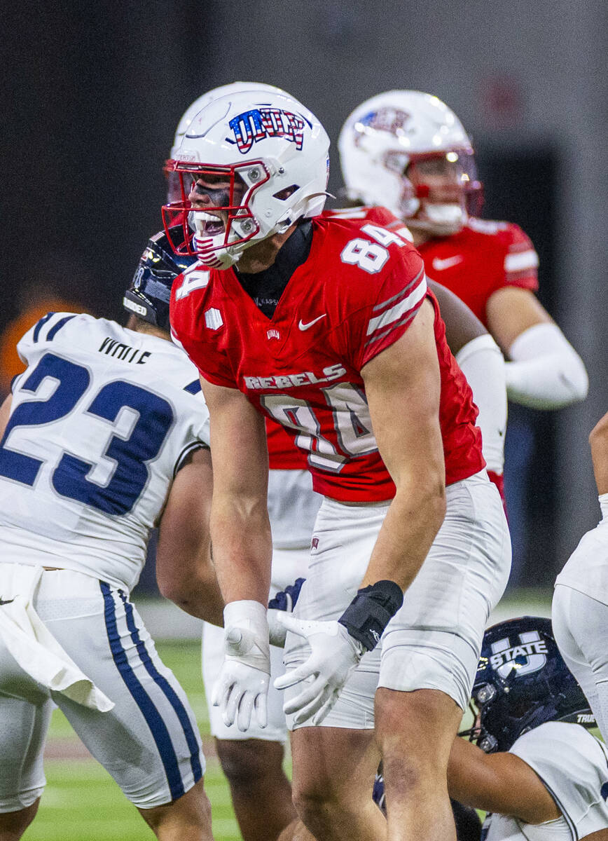 UNLV tight end Nick Elksnis (84) is pumped after a great tackle on a Utah State kickoff returne ...