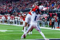 UNLV wide receiver Jaden Bradley (6) attempts a touchdown reception defended by Utah State Aggi ...