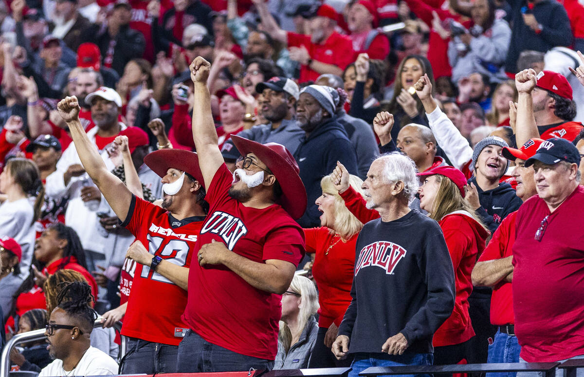 UNLV fans celebrate a late score against Utah State in a double overtime during the second half ...