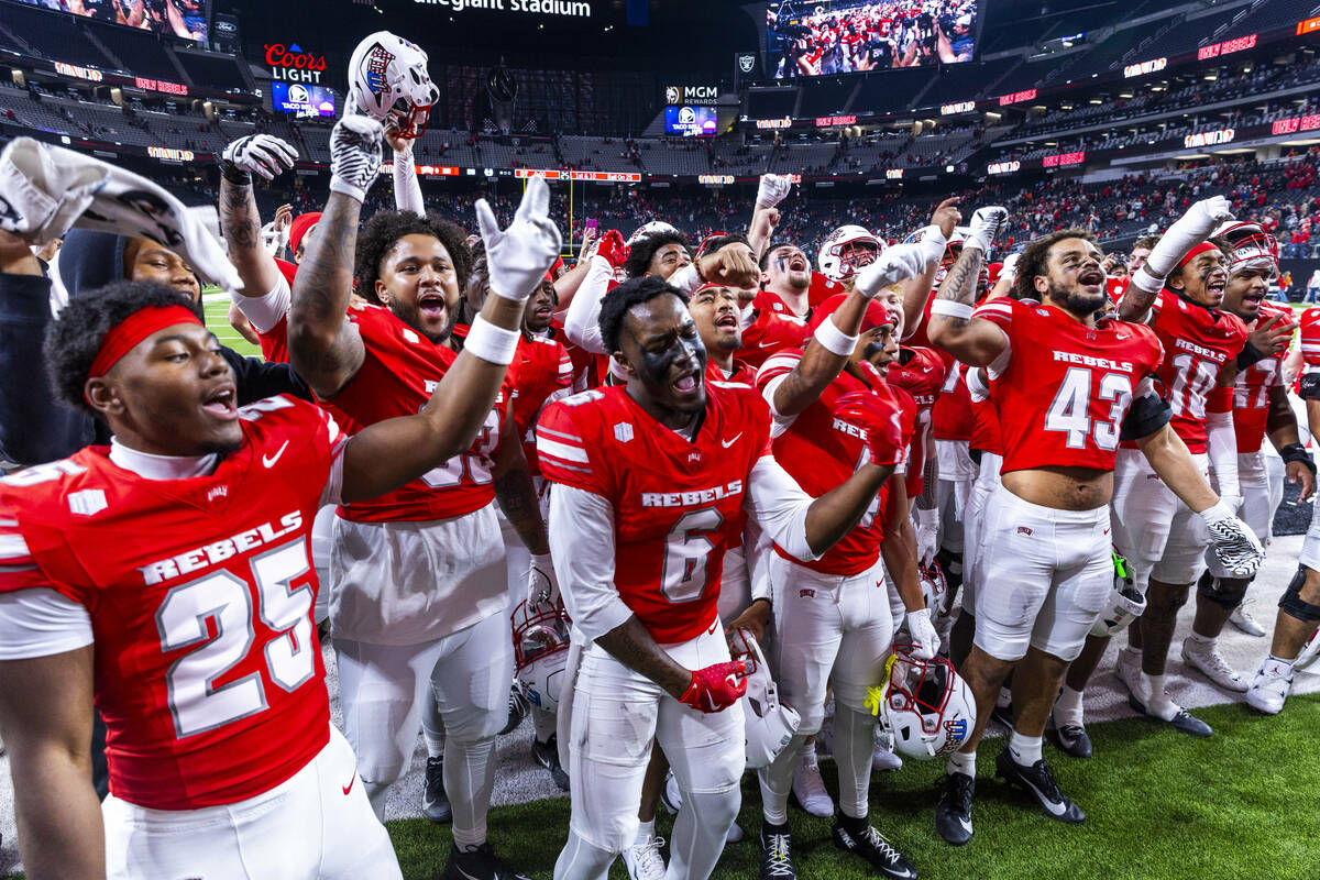 UNLV player sing the school fight song and dance in the end zone after their double overtime wi ...