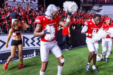UNLV defensive back Mumu bin-Wahad (6), defensive back Laterrance Welch (0) and defensive back ...