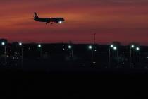 An airplane prepares to land at O'Hare International Airport, in Chicago, Wednesday, Nov. ...