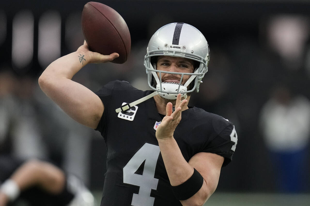Las Vegas Raiders quarterback Derek Carr (4) warms up before an NFL football game against the N ...