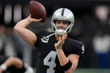 Las Vegas Raiders quarterback Derek Carr (4) warms up before an NFL football game against the N ...