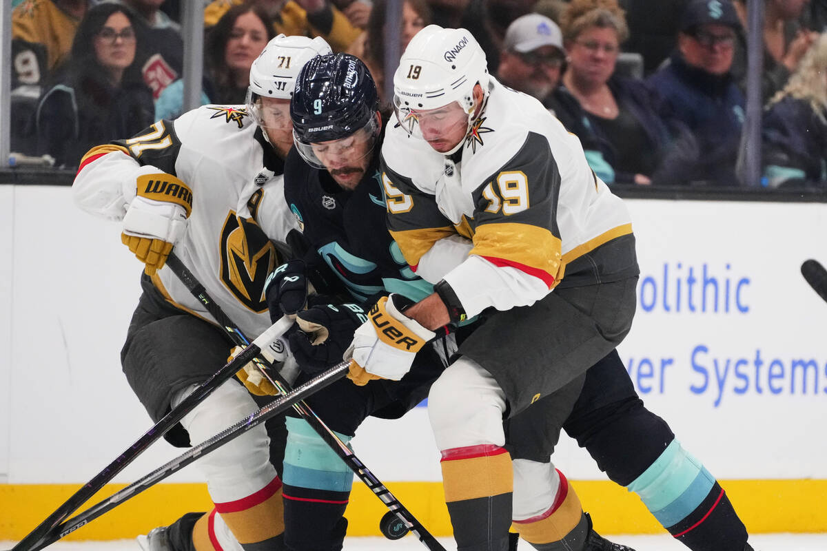 Vegas Golden Knights center William Karlsson, left, and right wing Reilly Smith (19) collide wi ...