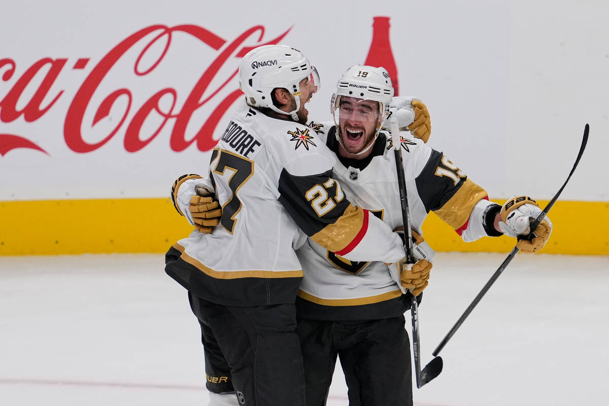 Vegas Golden Knights right wing Reilly Smith, right, celebrates with defenseman Shea Theodore a ...