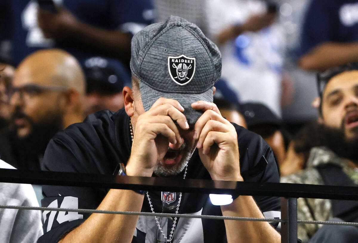 A Raiders fan reacts to a play as he watches the second half of an NFL game against Dallas Cowb ...