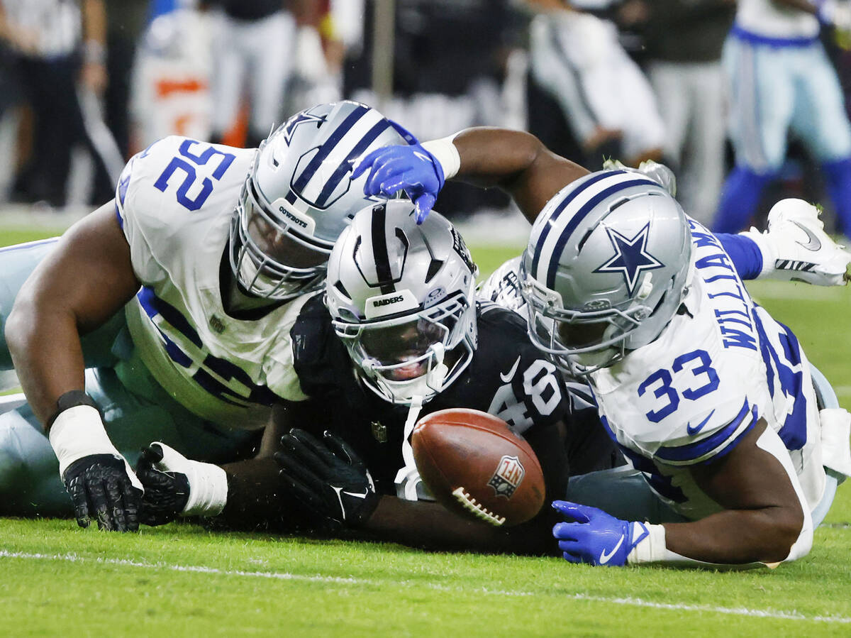 Dallas Cowboys cornerback Trikweze Bridges (25) running back Javonte Williams (33) and Raiders ...