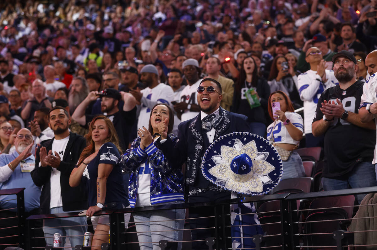 Dallas Cowboys fans cheer before the start of a ”Monday Night Football" NFL game ag ...