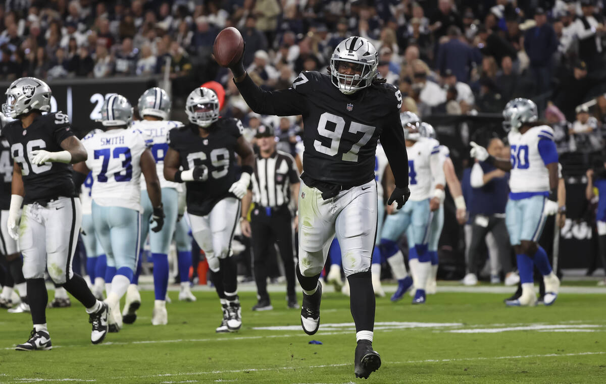 Raiders defensive tackle Tonka Hemingway (97) celebrates after recovering a fumble from the Dal ...