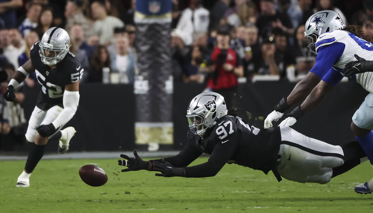 Raiders defensive tackle Tonka Hemingway (97) dives for a ball that was broken up in a pass fro ...
