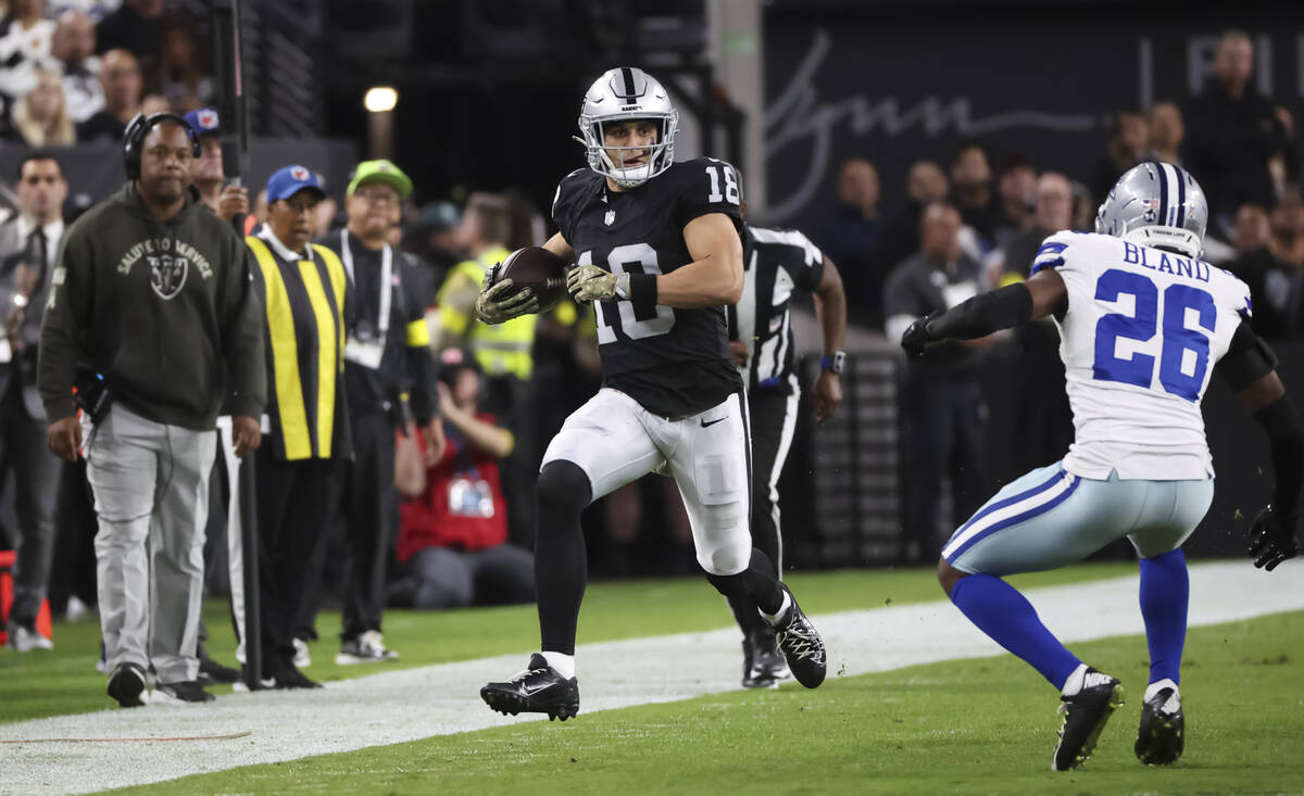 Raiders wide receiver Jack Bech (18) runs the ball against the Dallas Cowboys during the first ...