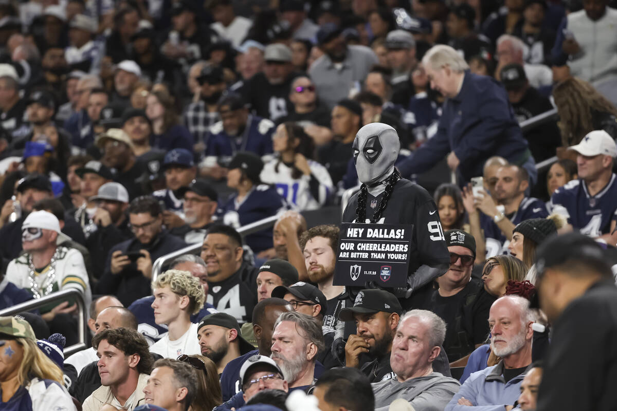 A Raiders fan looks on as the team trails the Dallas Cowboys during the second half of a &#x201 ...