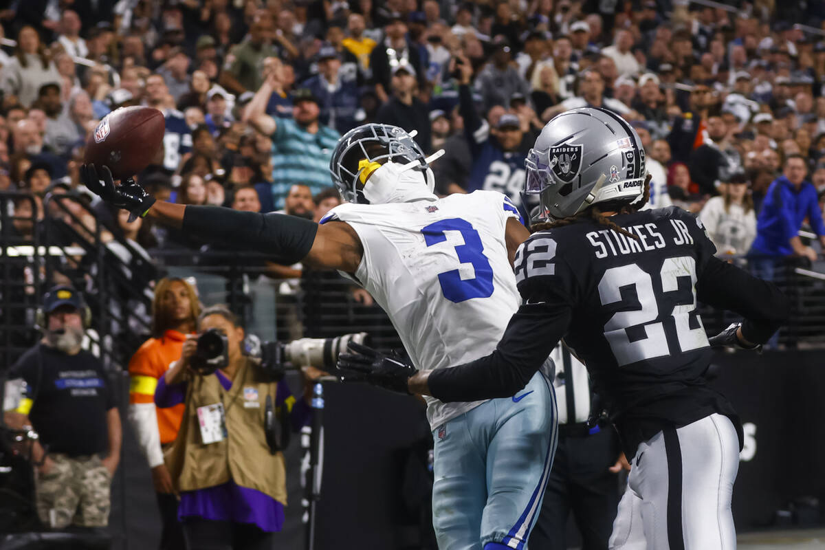 Dallas Cowboys wide receiver George Pickens (3) tries to pull in a touchdown pass as Raiders co ...