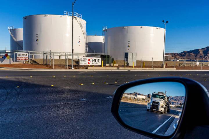 A tanker moves up the road across from the Rebel Oil Company facility outside of a fueling comp ...