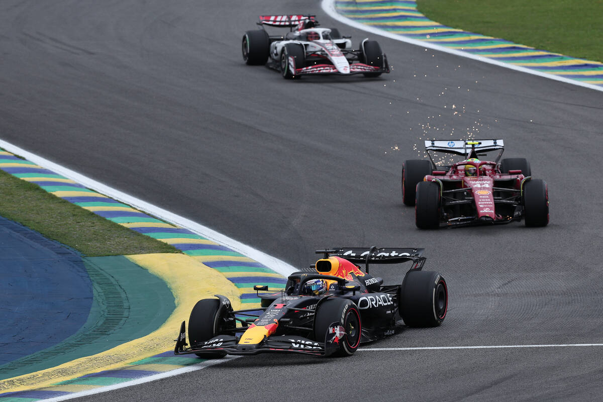 Red Bull driver Max Verstappen of the Netherlands steers his car followed by Ferrari driver Lew ...