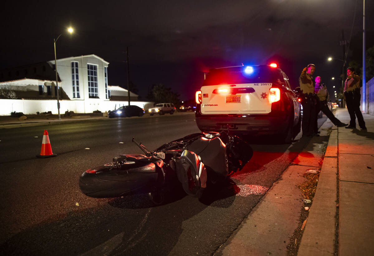 Metropolitan Police Department officers respond to the scene of a crash, where one victim was t ...