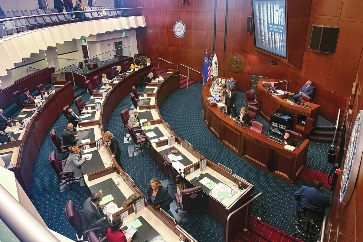 Senators gather before a floor meeting during the special session of the Nevada Legislature ear ...