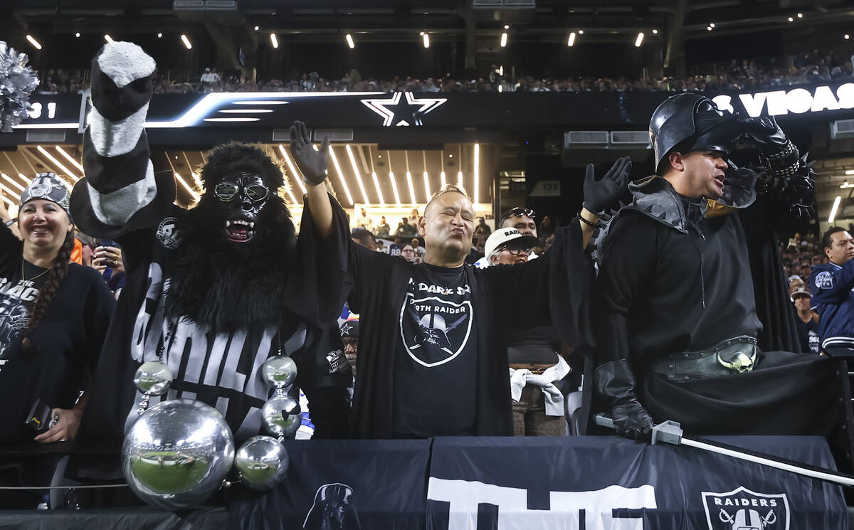 Raiders fans cheer before the start of a ”Monday Night Football" NFL game against t ...