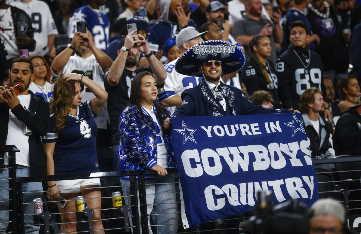 Dallas Cowboys fans cheer before the start of a ”Monday Night Football" NFL game ag ...