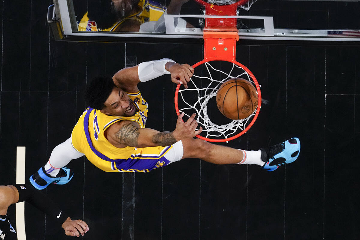 Los Angeles Lakers forward Christian Wood (35) scores in the second half of an NBA basketball g ...