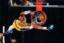 Los Angeles Lakers forward Christian Wood (35) scores in the second half of an NBA basketball g ...