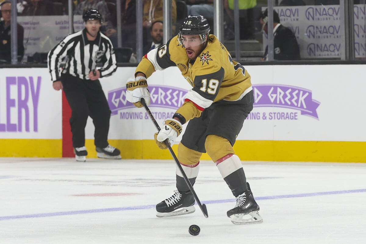 Golden Knights right wing Reilly Smith (19) passes the puck during the first period of an NHL h ...