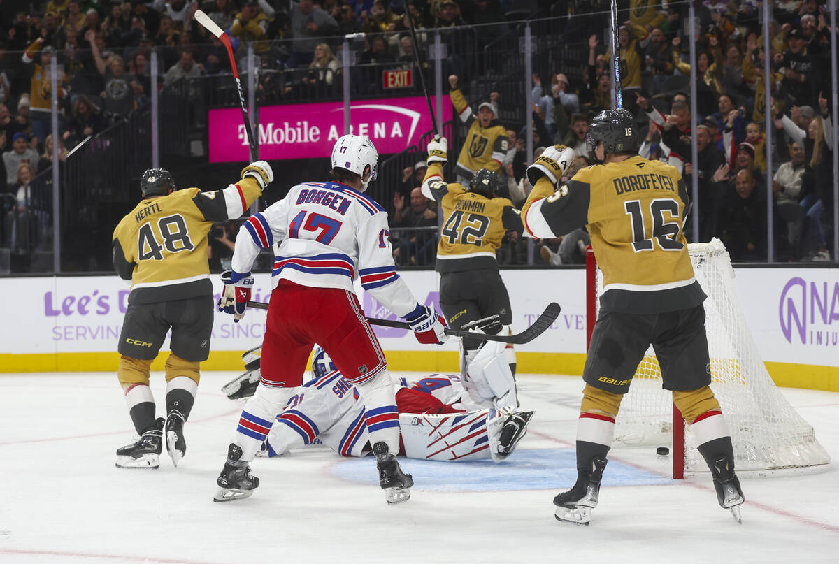 The Golden Knights celebrate a goal against the New York Rangers during the first period of an ...