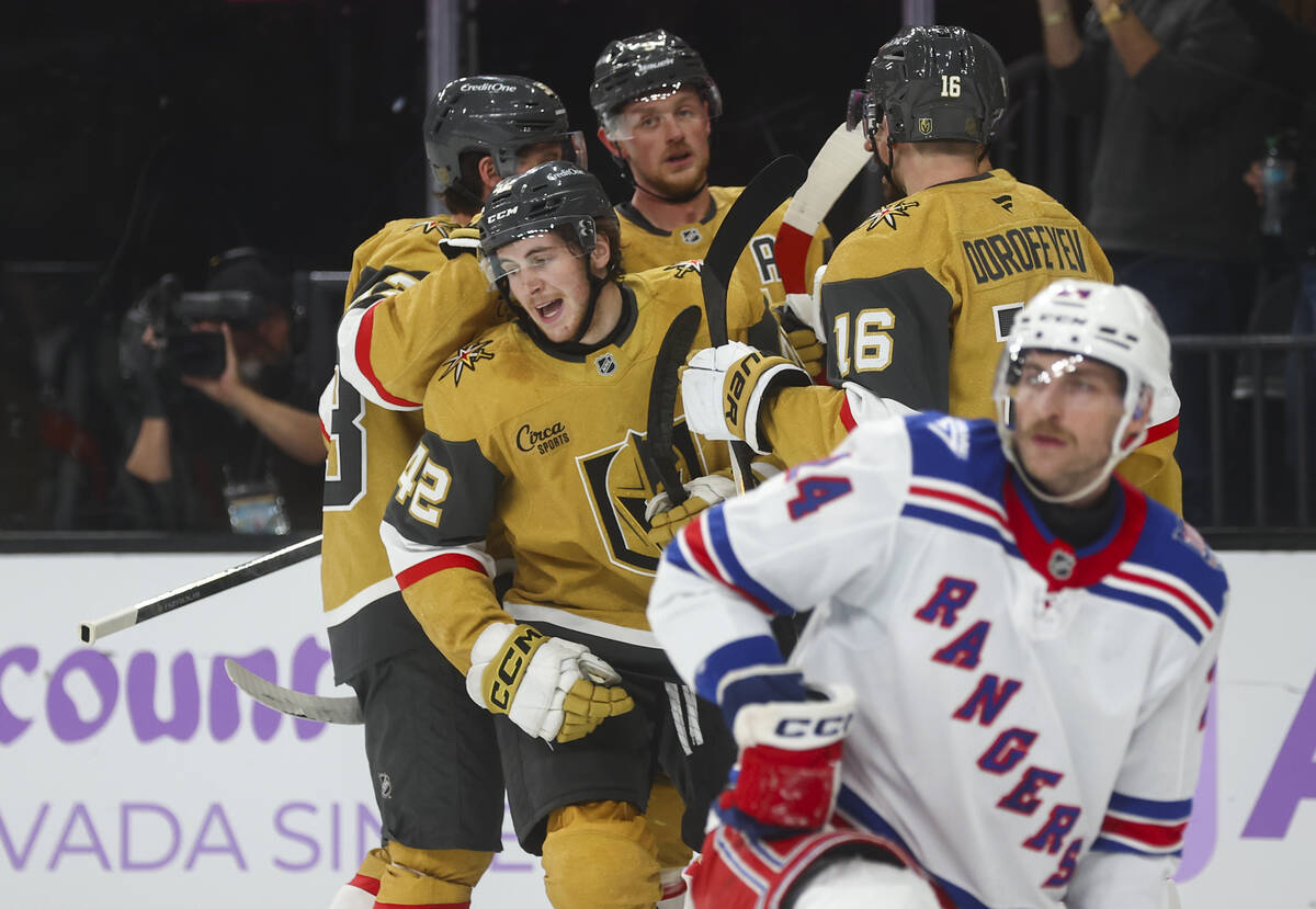 Golden Knights right wing Braeden Bowman (42) celebrates his goal with teammates during the fir ...