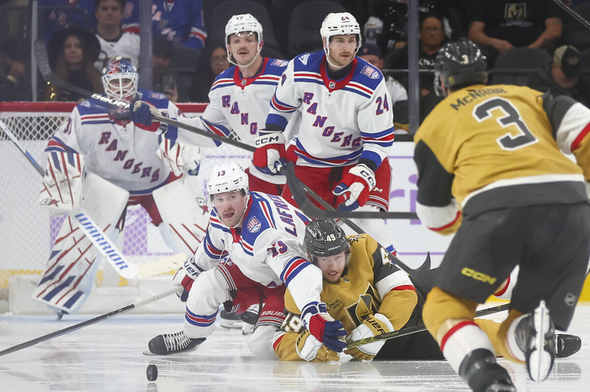 New York Rangers left wing Alexis Lafreniere (13) and Golden Knights left wing Ivan Barbashev ( ...