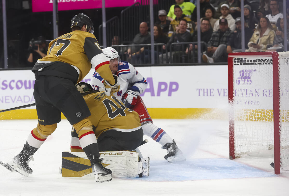 The New York Rangers score past Golden Knights goaltender Akira Schmid (40) during the second p ...