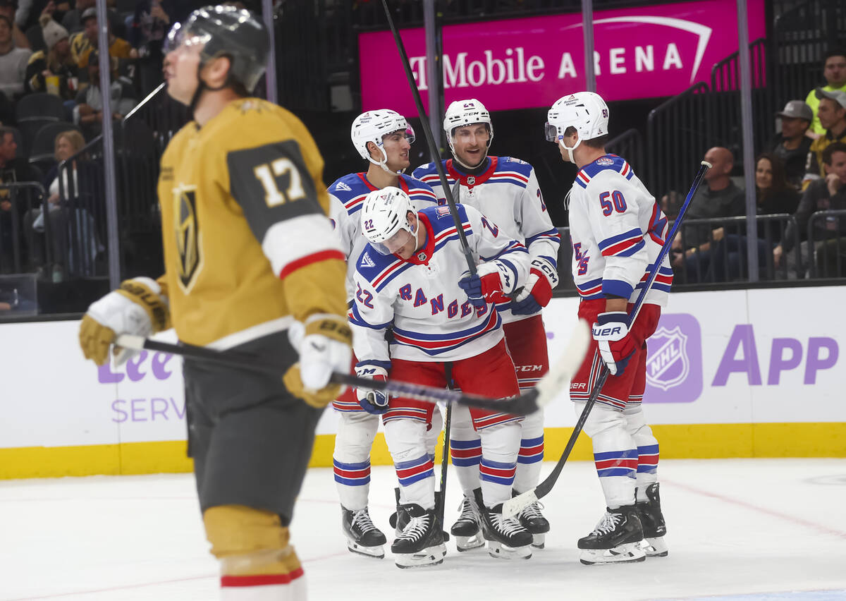 The New York Rangers celebrate after scoring a goal against the Golden Knights during the secon ...