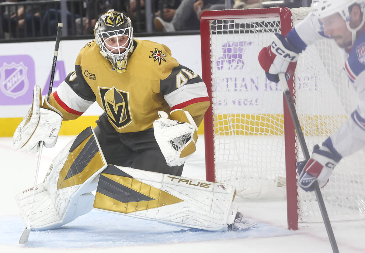 Golden Knights goaltender Akira Schmid (40) defends the net during the second period of an NHL ...