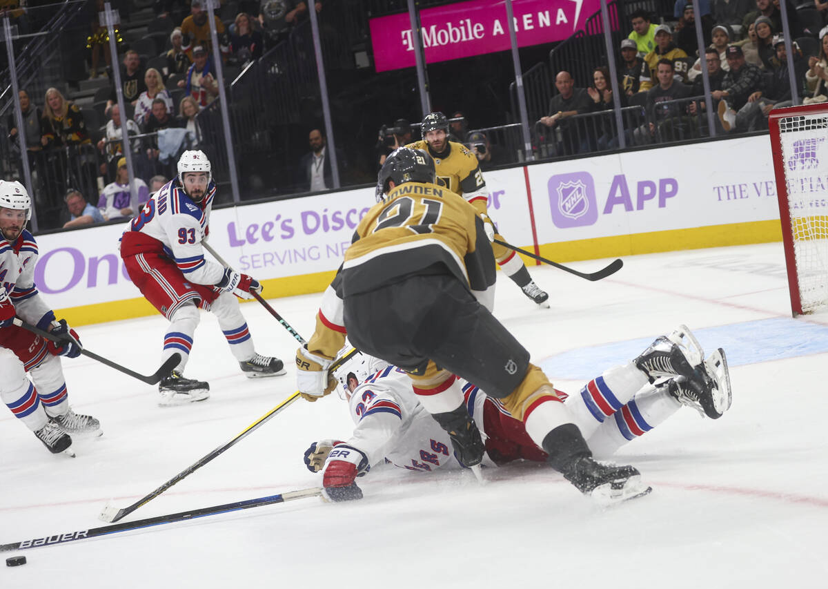 New York Rangers defenseman Adam Fox (23) blocks the shot of Golden Knights center Brett Howden ...