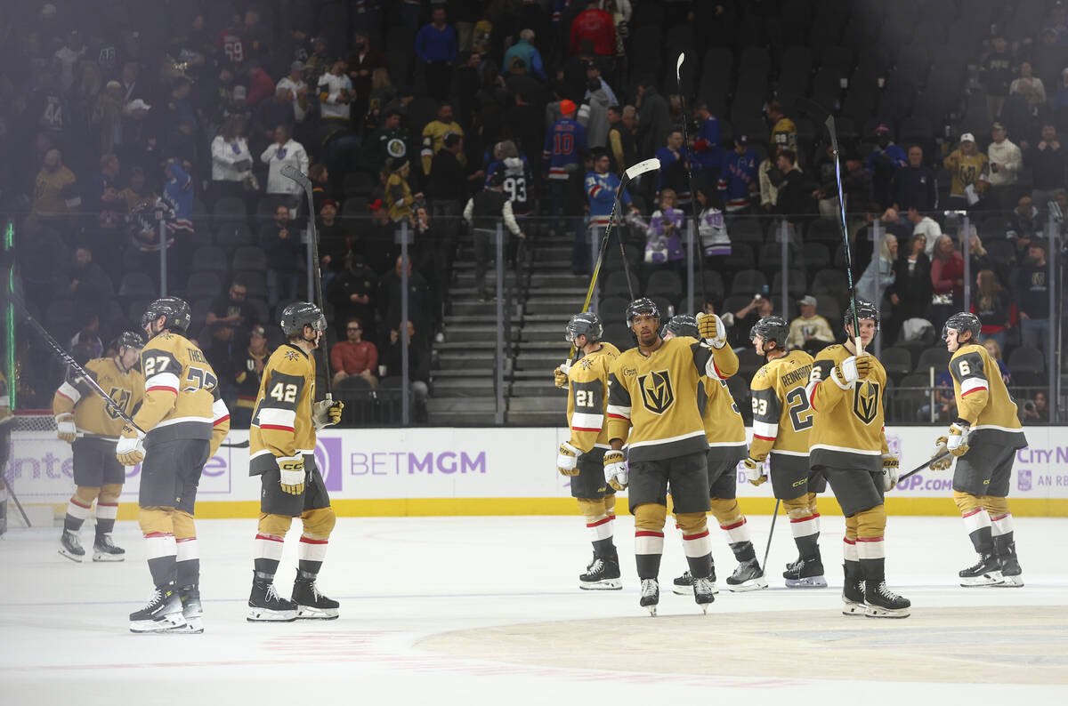 The Golden Knights celebrate after defeating the New York Rangers during the third period of an ...