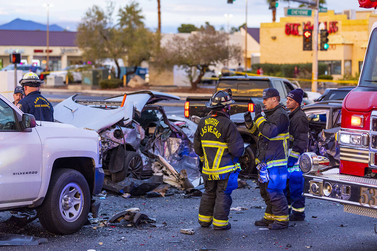 Las Vegas and North Las Vegas firefighters work the area as numerous vehicles are involved in a ...