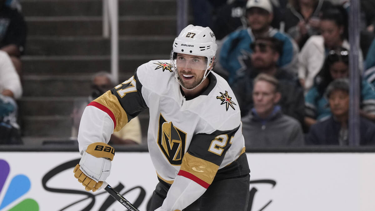 Vegas Golden Knights defenseman Shea Theodore moves the puck during the first period of an NHL ...