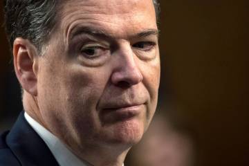 FILE - Former FBI Director James Comey testifies before the Senate Select Committee on Intellig ...