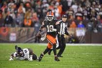 Cleveland Browns quarterback Shedeur Sanders scrambles during an NFL football game against the ...