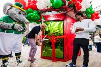 The Giving Machine opened at Downtown Summerlin for the holiday giving season with help from At ...
