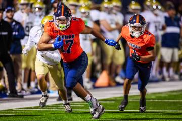 Bishop Gorman tight end Trent Walker runs the ball during a Open Division high school football ...