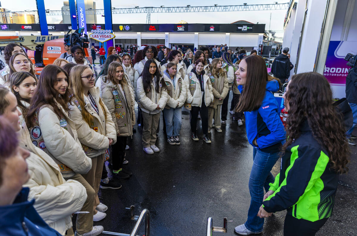 A group from the Girl Scouts of Southern Nevada talk with F1 Academy race car drivers Nina Gade ...