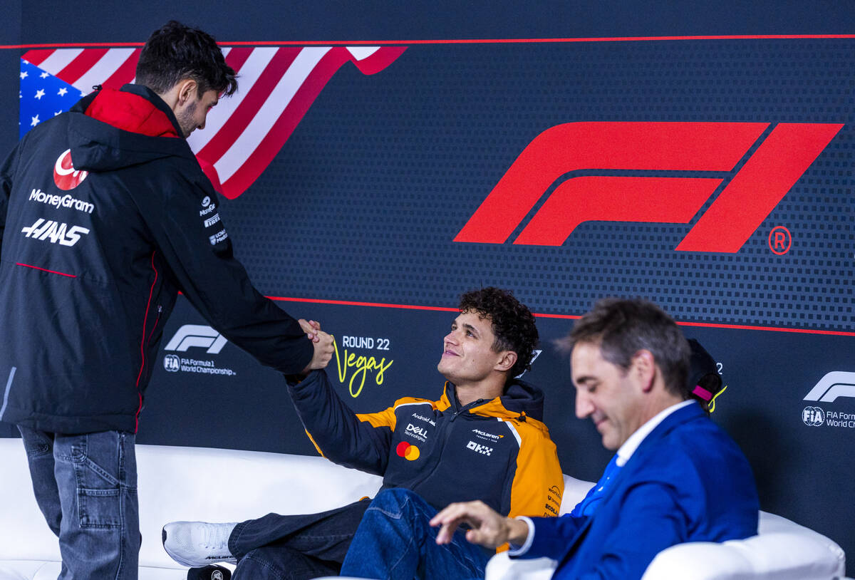 Haas F1 Team driver Esteban Ocon greets McLaren F1 Team driver Lando Norris as they ready for a ...
